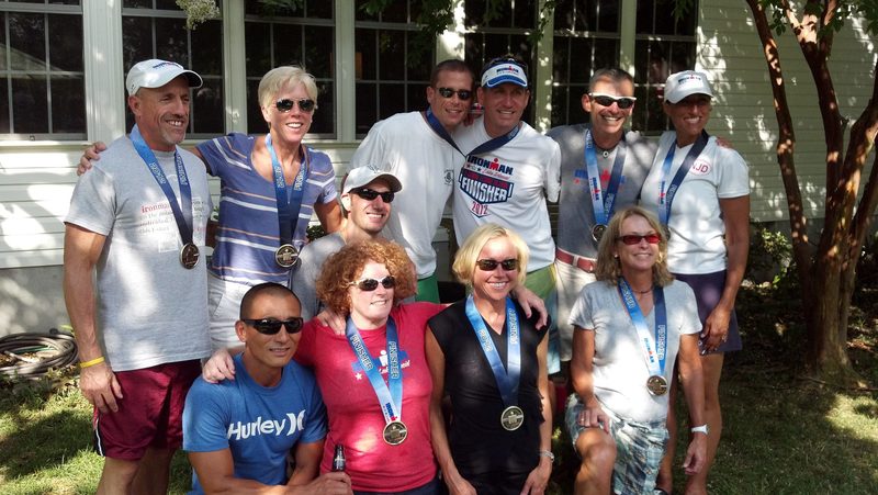 Ironman Lake Placid finishers include in back (l-r) Meyer Persow, Linda Reck, Brendon Murray, Chris Nutter, Bruce Clayton and Cindi Spencer; middle: Erik Farinas. In front are Brandt Chi, Amy Linzey, Mary Beth Evans and Ginger Watkins. Not pictured: Todd Smallwood. Kathy Crawford, Shannon Showalter and coach Kevin Danahy. SOURCE SUBMITTED